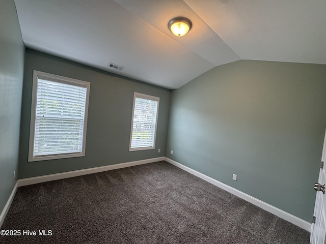 427 Wolfe Ln, Hubert, NC 28539 - empty room with vaulted ceiling and dark carpet