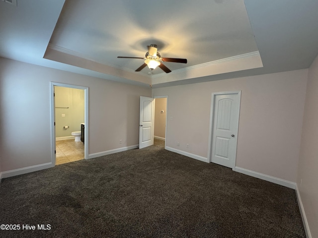 427 Wolfe Ln, Hubert, NC 28539 - unfurnished bedroom featuring a tray ceiling, crown molding, carpet, and connected bathroom