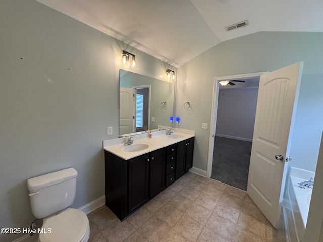 427 Wolfe Ln, Hubert, NC 28539 - bathroom featuring lofted ceiling, double vanity, and a garden tub