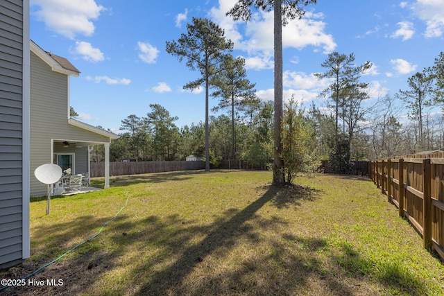 427 Wolfe Ln, Hubert, NC 28539 - fenced backyard featuring ceiling fan and a patio