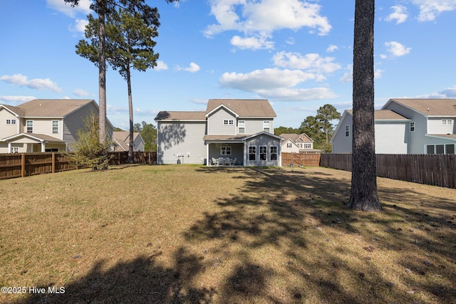 427 Wolfe Ln, Hubert, NC 28539 - back of house with a fenced backyard and a residential view