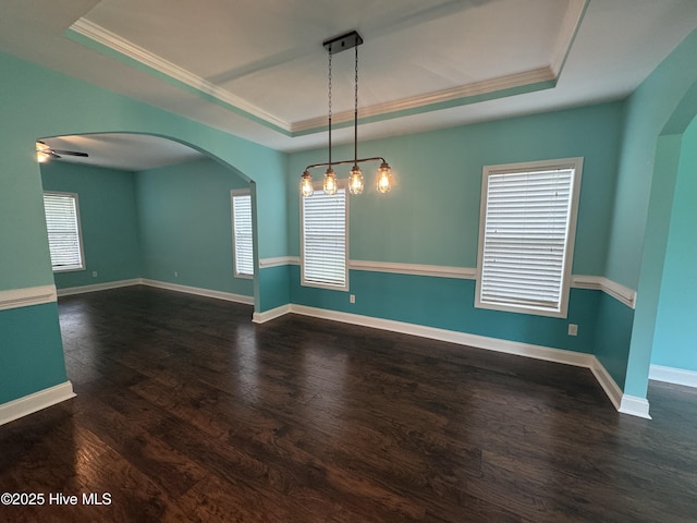 427 Wolfe Ln, Hubert, NC 28539 - unfurnished room featuring a raised ceiling, arched walkways, crown molding, healthy amount of natural light, and wood finished floors