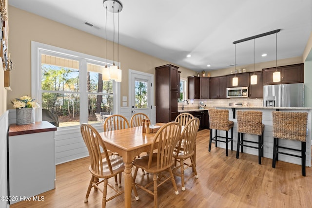 214 Green Trees Dr, New Bern, NC 28560 - dining space featuring recessed lighting, a wealth of natural light, light wood-type flooring, and visible vents