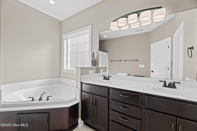 214 Green Trees Dr, New Bern, NC 28560 - bathroom with double vanity, a sink, a bath, and visible vents