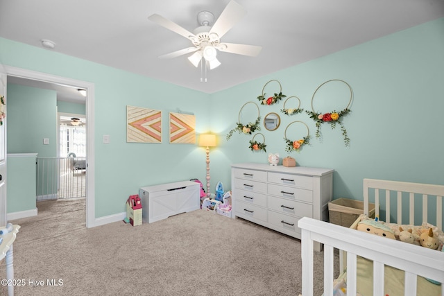 214 Green Trees Dr, New Bern, NC 28560 - bedroom with baseboards, ceiling fan, a nursery area, and light carpet