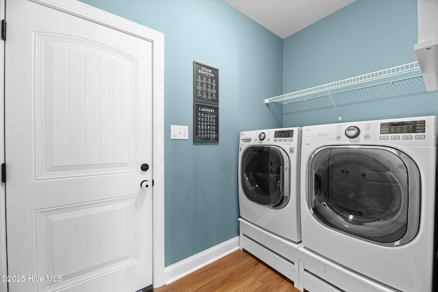 214 Green Trees Dr, New Bern, NC 28560 - clothes washing area with laundry area, baseboards, washing machine and dryer, and wood finished floors
