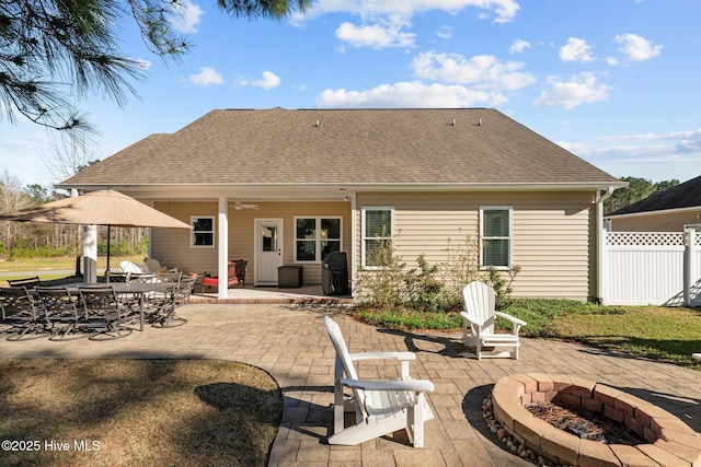 214 Green Trees Dr, New Bern, NC 28560 - rear view of property featuring a patio, fence, a fire pit, and a shingled roof