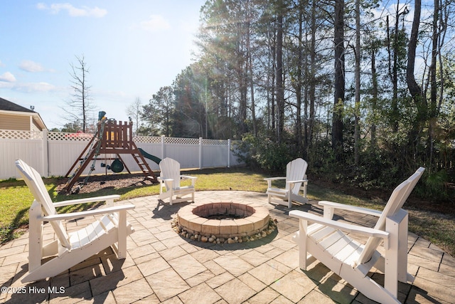 214 Green Trees Dr, New Bern, NC 28560 - view of patio / terrace with a fenced backyard, a playground, and an outdoor fire pit