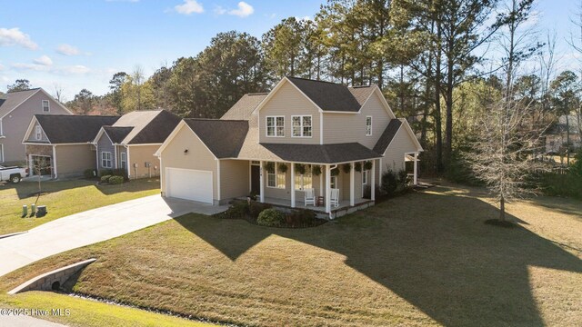 214 Green Trees Dr, New Bern, NC 28560 - traditional-style house with an attached garage, a porch, driveway, and a front yard