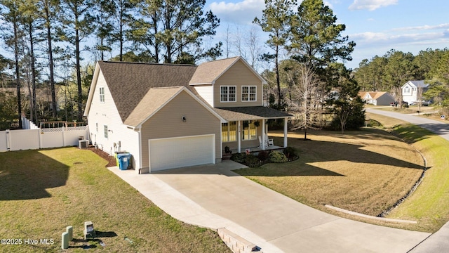 214 Green Trees Dr, New Bern, NC 28560 - traditional home with fence, a front yard, central AC unit, covered porch, and driveway