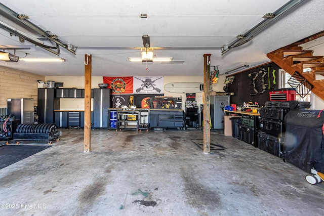 garage featuring a workshop area and a garage door opener