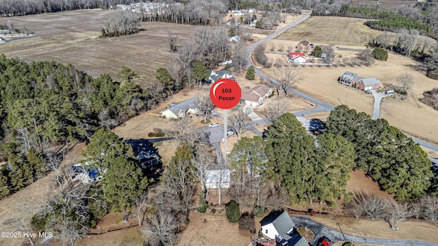 birds eye view of property with a rural view