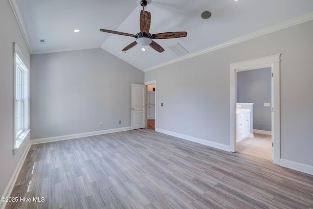 spare room with light wood finished floors, visible vents, a ceiling fan, and baseboards