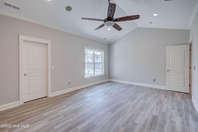 spare room with ceiling fan, crown molding, visible vents, and light wood-style flooring