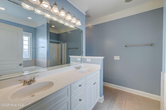 bathroom featuring tile patterned flooring, a sink, crown molding, and a stall shower