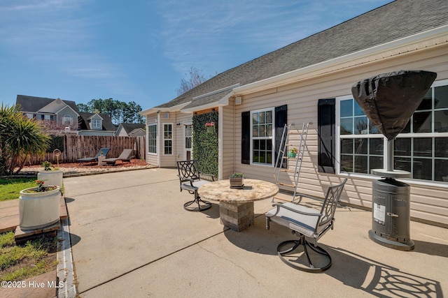 view of patio featuring fence