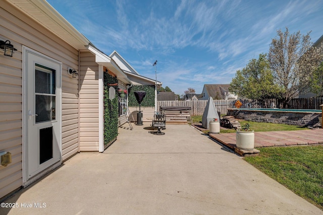 view of patio with a fenced in pool and a fenced backyard