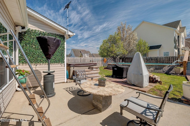 view of patio with a pool, a hot tub, and a fenced backyard