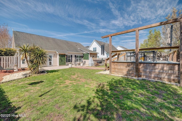 view of yard featuring a patio and a deck