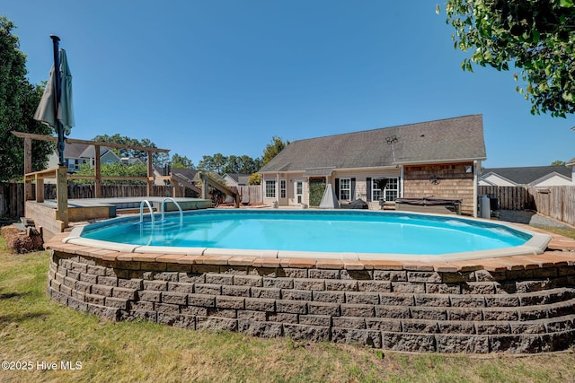 view of swimming pool with a fenced in pool and a fenced backyard