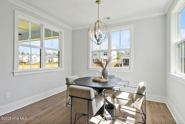 1348 Trisail Ter, Wilmington, NC 28412 - dining room with plenty of natural light, visible vents, dark wood-style flooring, and a notable chandelier