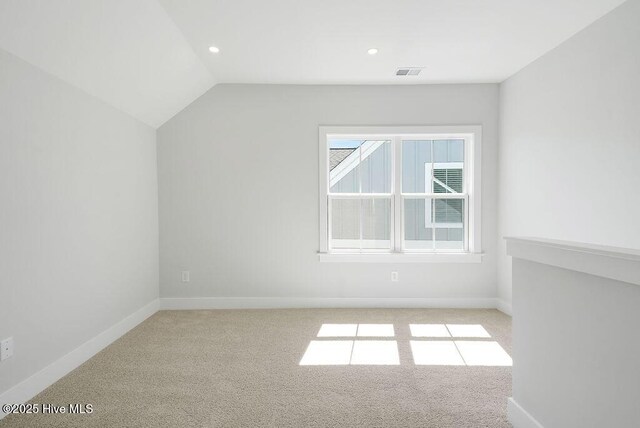 1348 Trisail Ter, Wilmington, NC 28412 - additional living space with visible vents, baseboards, carpet flooring, and lofted ceiling