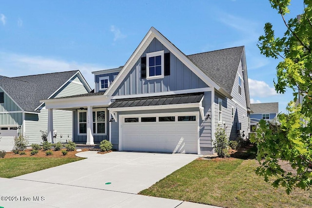 1348 Trisail Ter, Wilmington, NC 28412 - view of front of house with roof with shingles, a standing seam roof, concrete driveway, covered porch, and board and batten siding