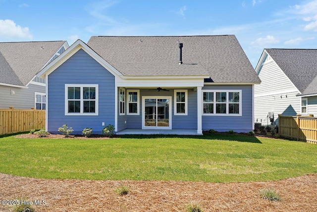 1348 Trisail Ter, Wilmington, NC 28412 - rear view of property featuring a lawn, ceiling fan, a fenced backyard, and a patio area