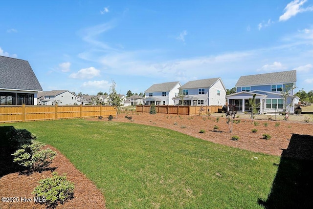 1348 Trisail Ter, Wilmington, NC 28412 - view of yard featuring a fenced backyard, a sunroom, and a residential view