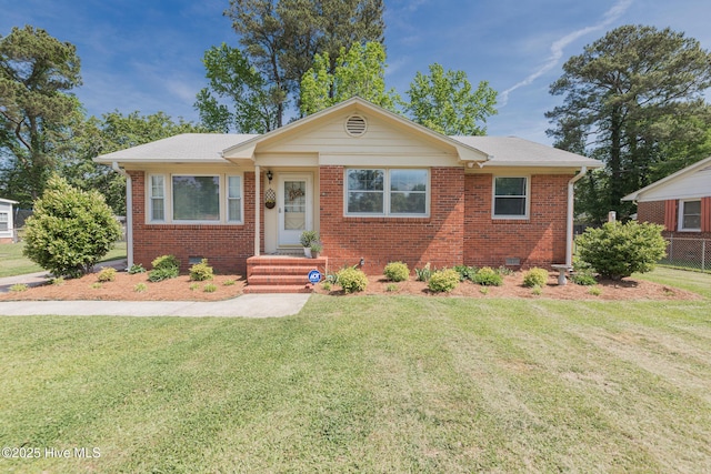 203 Mercer Rd, Jacksonville, NC 28546 - bungalow-style house with brick siding and a front lawn
