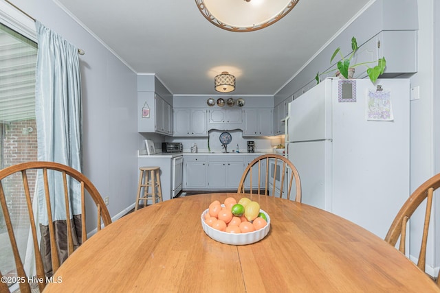 203 Mercer Rd, Jacksonville, NC 28546 - dining room with ornamental molding and washer / dryer