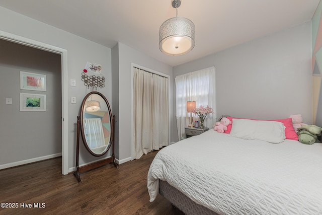 203 Mercer Rd, Jacksonville, NC 28546 - bedroom featuring dark wood-style flooring, a closet, and baseboards