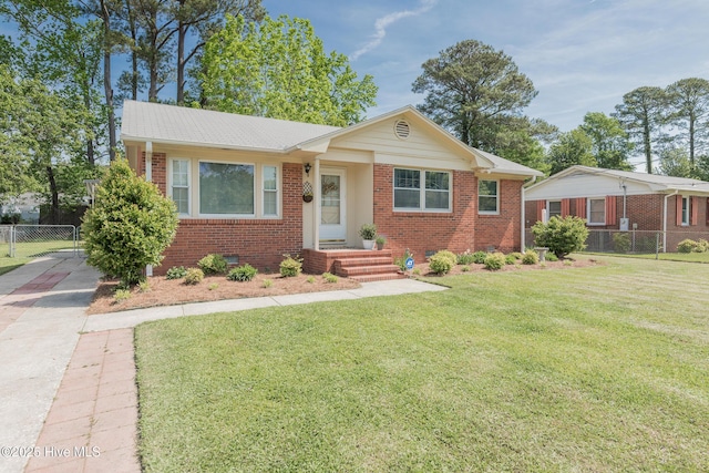 203 Mercer Rd, Jacksonville, NC 28546 - view of front of property featuring brick siding, driveway, and crawl space