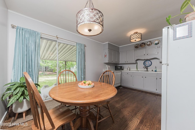 203 Mercer Rd, Jacksonville, NC 28546 - dining space featuring dark wood-style floors and crown molding