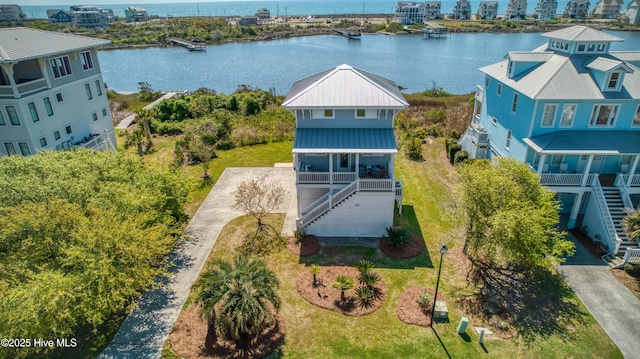 drone / aerial view with a water view
