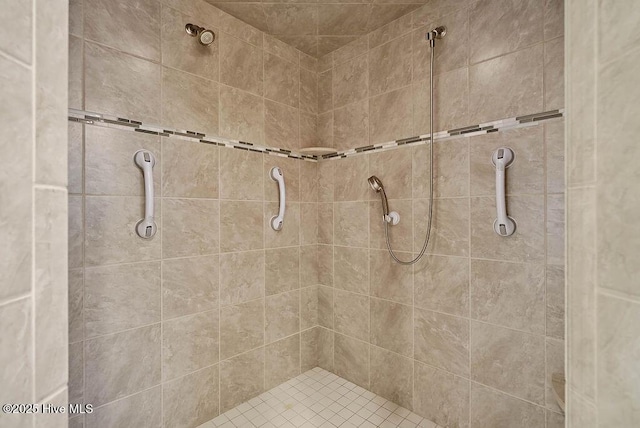 full bath featuring tiled shower