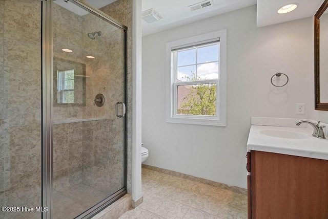 bathroom featuring visible vents, tile patterned floors, vanity, and a stall shower