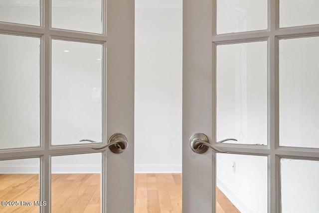 room details featuring wood finished floors and baseboards
