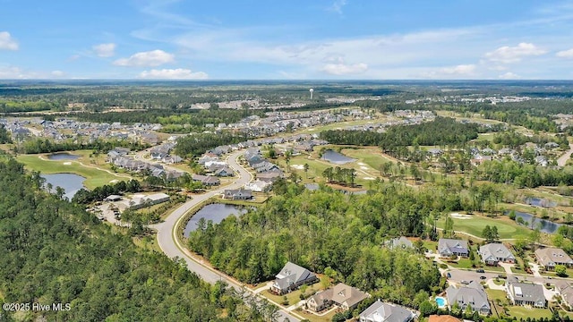 drone / aerial view with a water view, golf course view, and a residential view