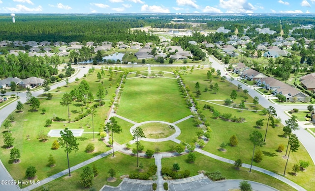 drone / aerial view with a view of trees and a residential view
