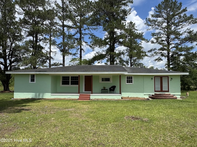 1309 Gaston Sellers Rd, Whiteville, NC 28472 - view of front of house featuring a front yard, concrete block siding, and covered porch