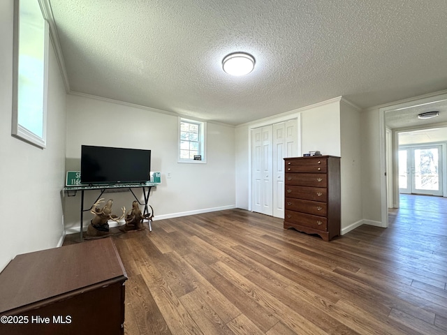 1309 Gaston Sellers Rd, Whiteville, NC 28472 - interior space featuring wood finished floors, a textured ceiling, plenty of natural light, baseboards, and crown molding