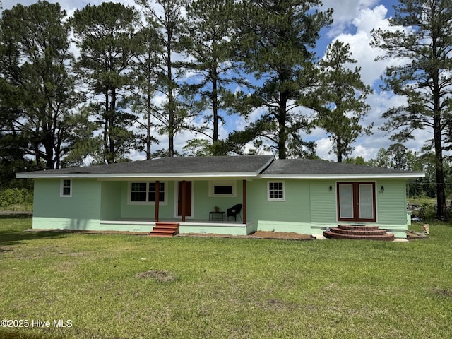 1309 Gaston Sellers Rd, Whiteville, NC 28472 - ranch-style house with a front lawn, a porch, and roof with shingles