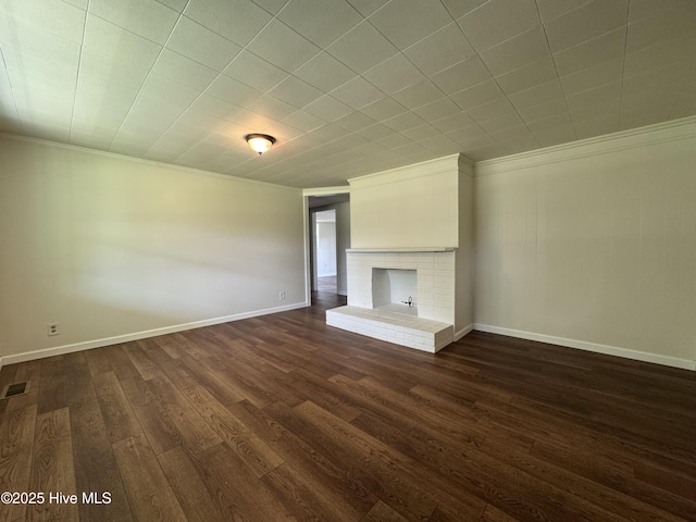 1309 Gaston Sellers Rd, Whiteville, NC 28472 - unfurnished living room featuring ornamental molding, a fireplace, dark wood-style floors, and baseboards