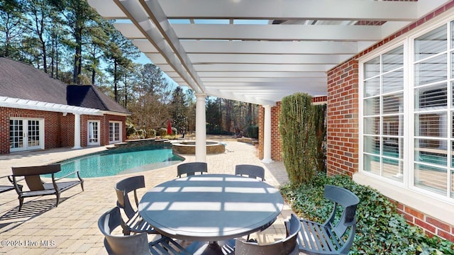 view of swimming pool featuring a pool with connected hot tub, a pergola, a patio, french doors, and outdoor dining area