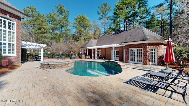 outdoor pool featuring a patio, french doors, and a pergola