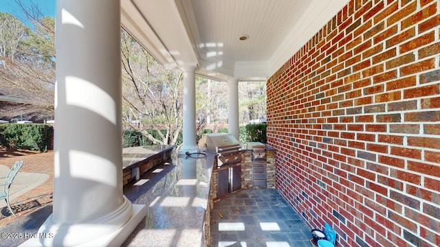 view of patio / terrace with grilling area and an outdoor kitchen