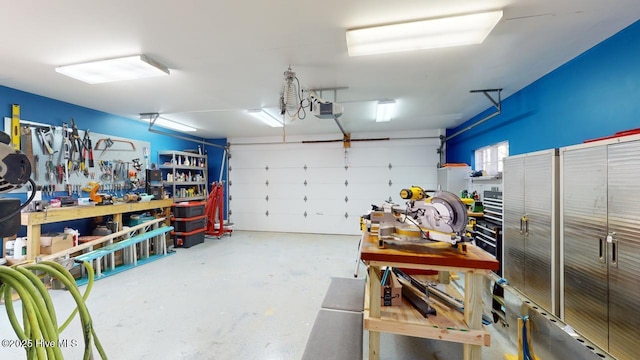 garage featuring a workshop area and a garage door opener