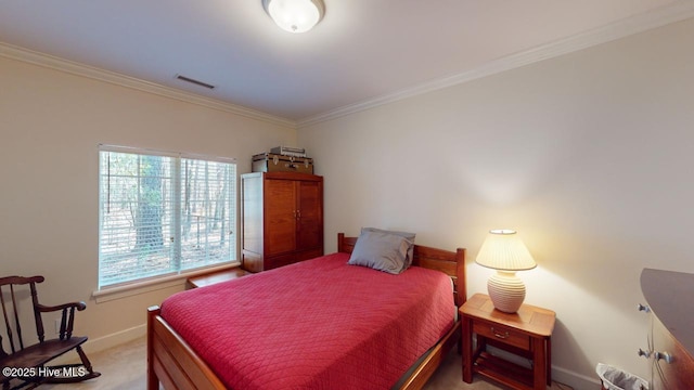 bedroom featuring visible vents, baseboards, light colored carpet, and ornamental molding