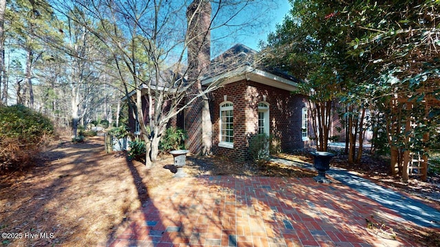 view of front of home featuring brick siding